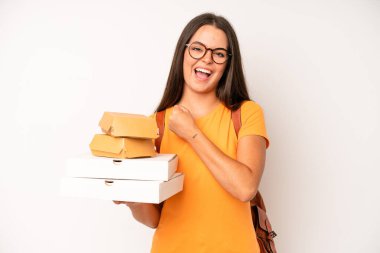 hispanic pretty woma feeling happy and astonished at something unbelievable. delivery take away concept