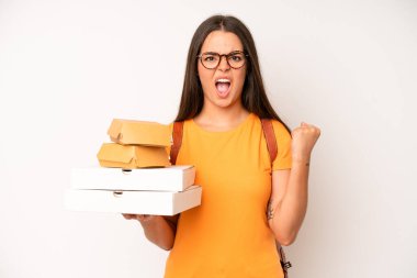 hispanic pretty woma shrugging, feeling confused and uncertain. delivery take away concept