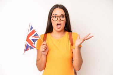 hispanic pretty woma feeling angry, annoyed, rebellious and aggressive. england flag concept