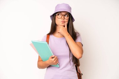 hispanic pretty woma smiling proudly and confidently making number one. university student concept