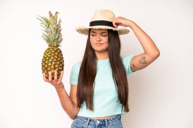 hispanic pretty woma smiling and looking friendly, showing number three. pineapple and summer concept