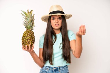 hispanic pretty woma feeling like a happy and excited genius after realizing an idea. pineapple and summer concept