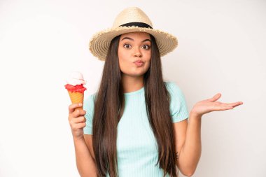 hispanic pretty woma smiling and looking friendly, showing number five. ice cream and summer concept