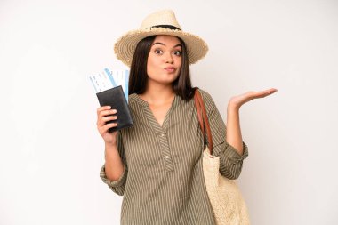 hispanic pretty woma smiling and looking friendly, showing number five. travel and summer concept