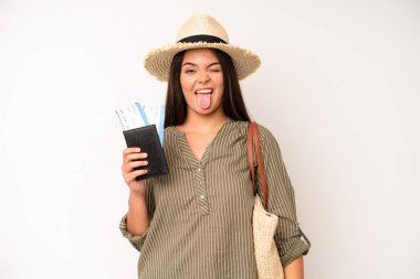 hispanic pretty woma looking shocked and surprised with mouth wide open, pointing to self. travel and summer concept
