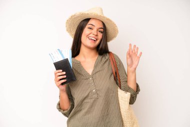 hispanic pretty woma looking happy and pleasantly surprised. travel and summer concept