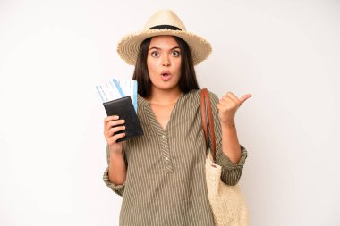 hispanic pretty woma feeling puzzled and confused and doubting. travel and summer concept