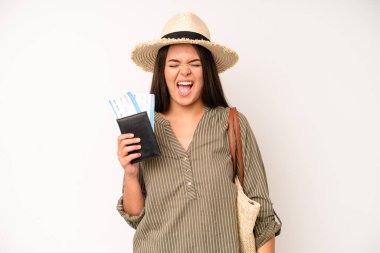 hispanic pretty woma laughing out loud at some hilarious joke. travel and summer concept