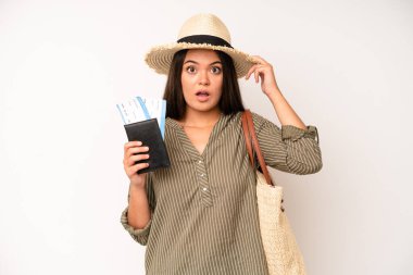 hispanic pretty woma feeling happy, showing approval with okay gesture. travel and summer concept