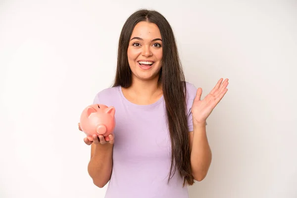 Hispanic Pretty Woma Feeling Shocked Scared Piggy Bank Savings Concept — Fotografia de Stock