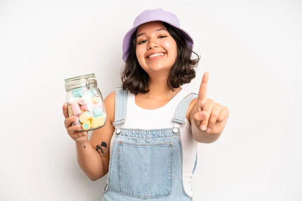 Hispanic Pretty Woma Smiling Proudly Confidently Making Number One Candies — Foto Stock
