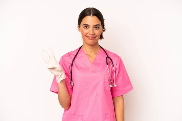 Pretty Hispanic Woman Smiling Looking Friendly Showing Number Three Veterinarian — Fotografia de Stock