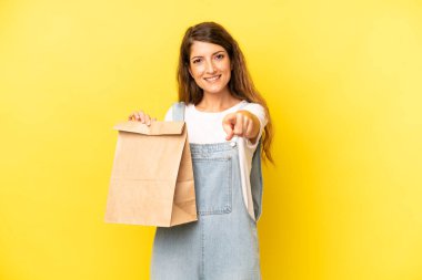 pretty caucasian woman pointing at camera choosing you. take away concept