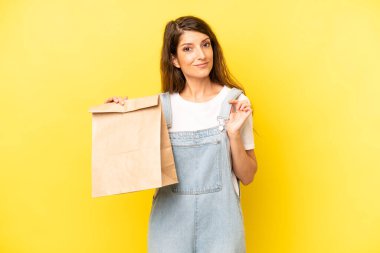 pretty caucasian woman looking arrogant, successful, positive and proud. take away concept