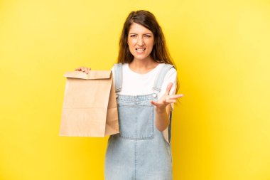 pretty caucasian woman looking angry, annoyed and frustrated. take away concept