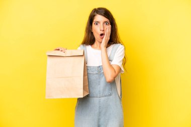 pretty caucasian woman feeling shocked and scared. take away concept