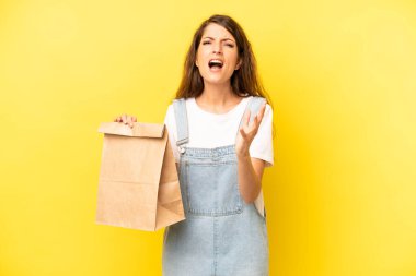 pretty caucasian woman looking desperate, frustrated and stressed. take away concept