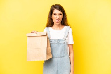 pretty caucasian woman feeling disgusted and irritated and tongue out. take away concept