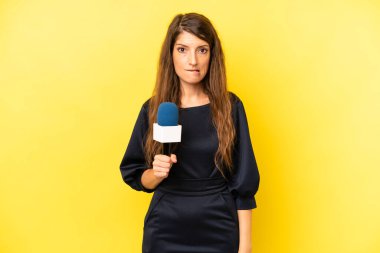 pretty caucasian woman looking puzzled and confused. tv presenter concept