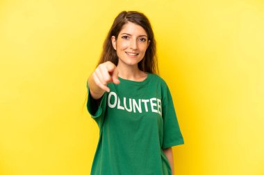 pretty caucasian woman pointing at camera choosing you. enviromental volunteer concept