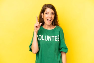 pretty caucasian woman feeling like a happy and excited genius after realizing an idea. enviromental volunteer concept
