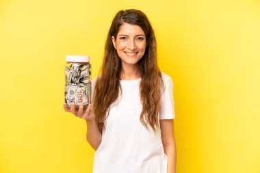 pretty caucasian woman looking happy and pleasantly surprised. dollar banknotes savings