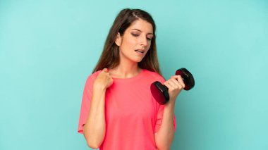pretty caucasian woman feeling stressed, anxious, tired and frustrated. fitness and dumbbell concept