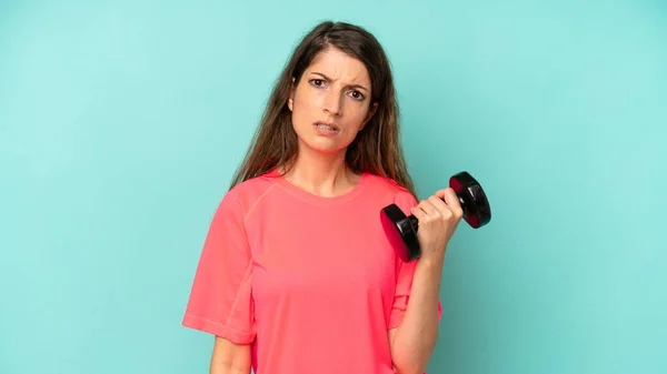 Pretty Caucasian Woman Feeling Puzzled Confused Fitness Dumbbell Concept — Foto de Stock