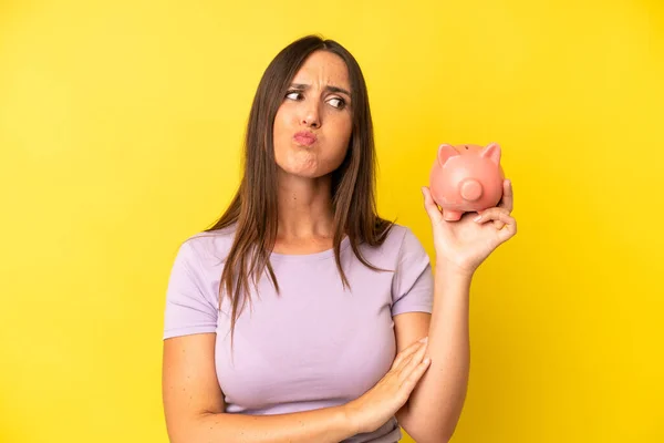 Hispanic Young Adult Woman Shrugging Feeling Confused Uncertain Piggy Bank — Stock Photo, Image