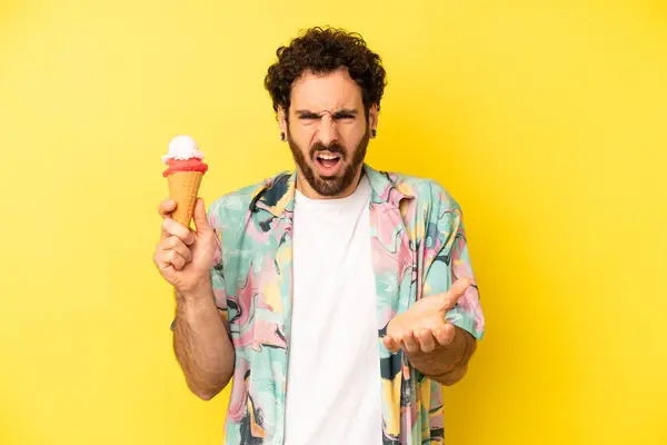 crazy bearded man looking angry, annoyed and frustrated. ice cream and summer concept