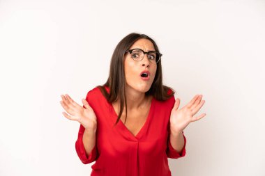 hispanic pretty woman feeling clueless and confused, having no idea, absolutely puzzled with a dumb or foolish look