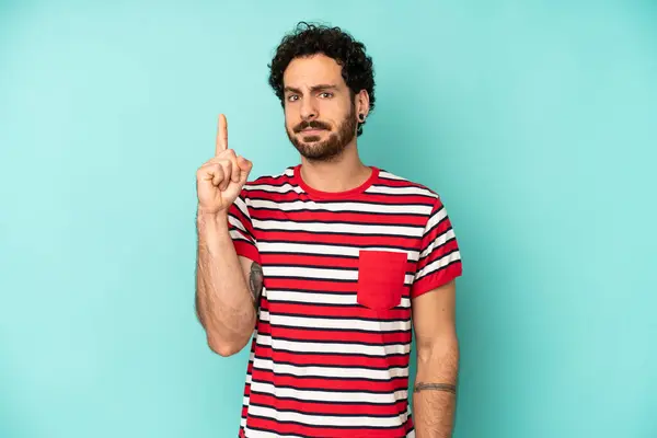 Young Bearded Man Feeling Genius Holding Finger Proudly Air Realizing — Stock Photo, Image
