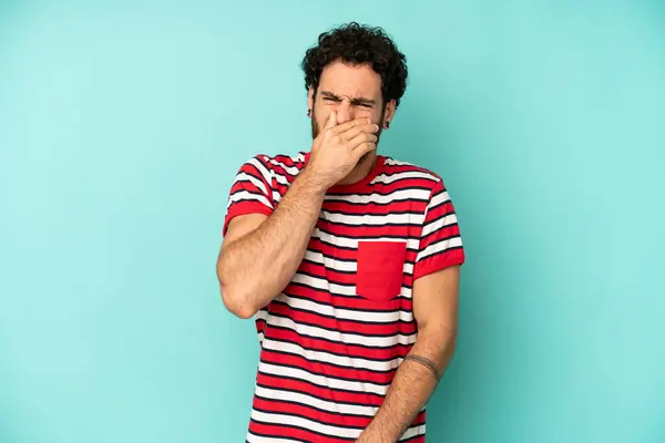 Young Bearded Man Feeling Disgusted Holding Nose Avoid Smelling Foul — Stock Photo, Image