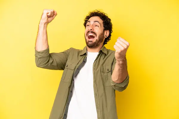 Young Bearded Man Shouting Triumphantly Looking Excited Happy Surprised Winner — Stock Photo, Image