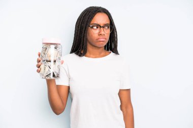 black pretty woman feeling sad, upset or angry and looking to the side. savings concept