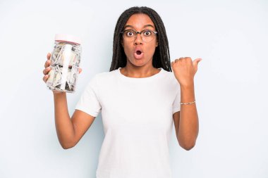 black pretty woman looking astonished in disbelief. savings concept