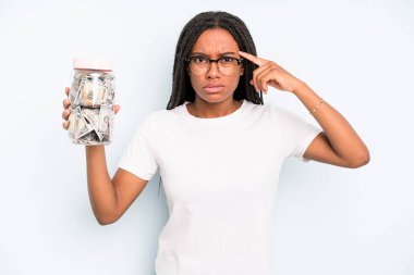 black pretty woman looking surprised, realizing a new thought, idea or concept. savings concept