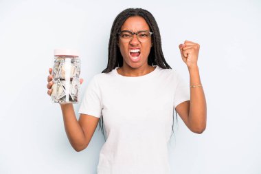 black pretty woman shouting aggressively with an angry expression. savings concept