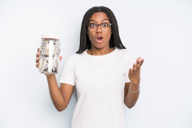 black pretty woman feeling extremely shocked and surprised. savings concept
