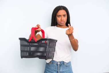 black pretty woman feeling angry, annoyed, rebellious and aggressive. empty shopping basket