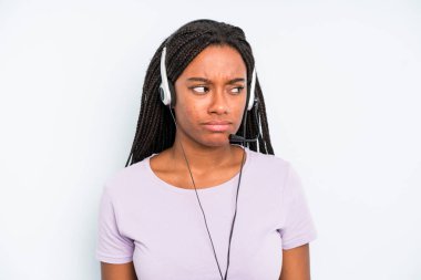 black pretty woman feeling sad, upset or angry and looking to the side. telemarketer concept