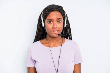 black pretty woman looking puzzled and confused. telemarketer concept