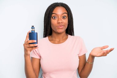 black pretty woman feeling puzzled and confused and doubting. smoker vaper concept