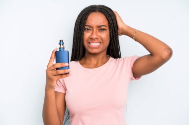 black pretty woman feeling stressed, anxious or scared, with hands on head. smoker vaper concept