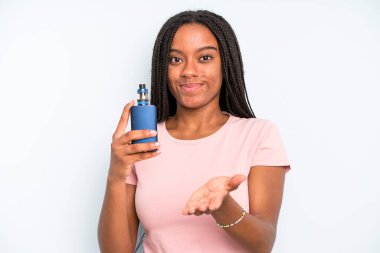 black pretty woman smiling happily with friendly and  offering and showing a concept. smoker vaper concept