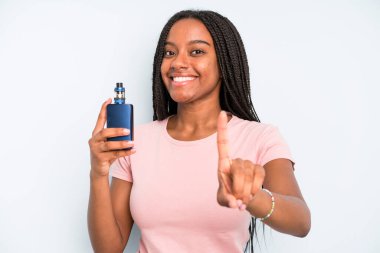 black pretty woman smiling proudly and confidently making number one. smoker vaper concept