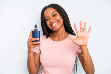 black pretty woman smiling and looking friendly, showing number five. smoker vaper concept