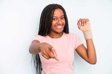 black pretty woman pointing at camera choosing you. broken hand concept