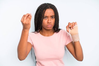 black pretty woman making capice or money gesture, telling you to pay. broken hand concept