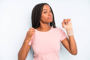 black pretty woman looking arrogant, successful, positive and proud. broken hand concept